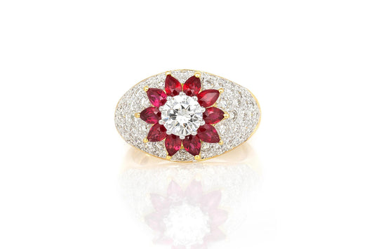 Vintage 1980s 0.80 Carat Round Brilliant Cut Diamond Flower Ring with Rubies