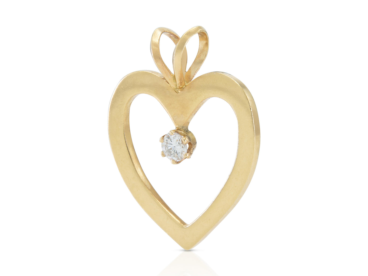 Vintage 1980s Gold Open Heart Pendant with a 0.30 Carat Diamond