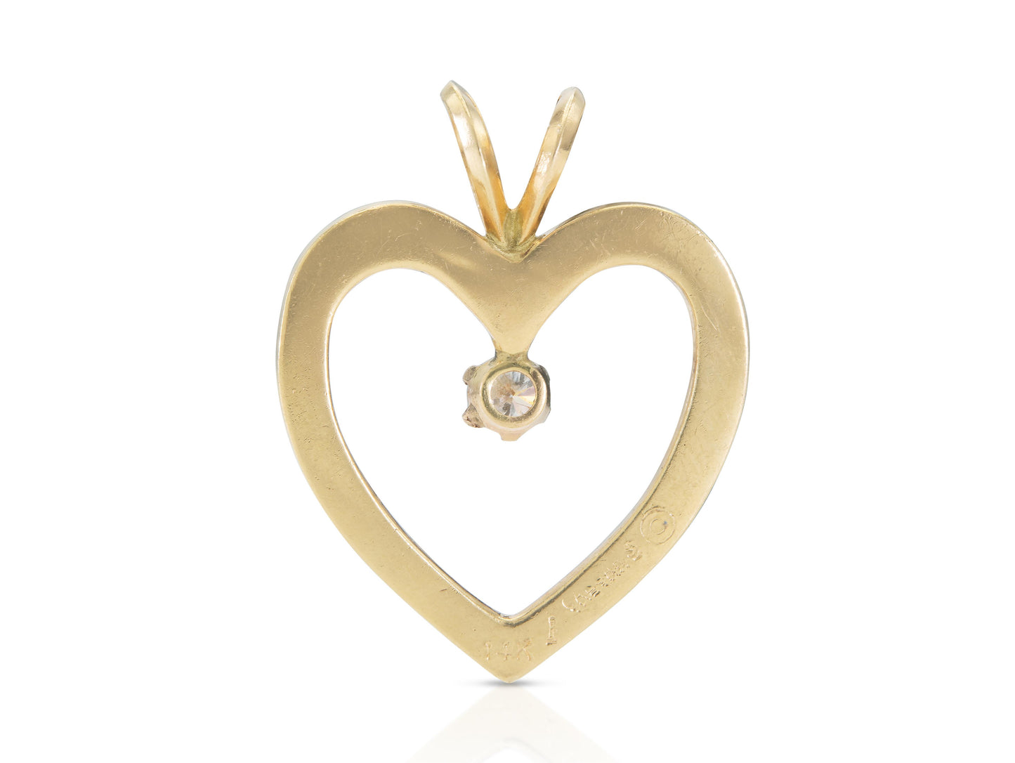 Vintage 1980s Gold Open Heart Pendant with a 0.30 Carat Diamond